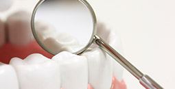 Dental mirror enlarging dental sealant treated smile